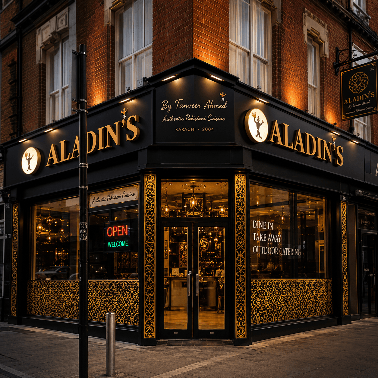 An ALADIN restaurant frontage at night